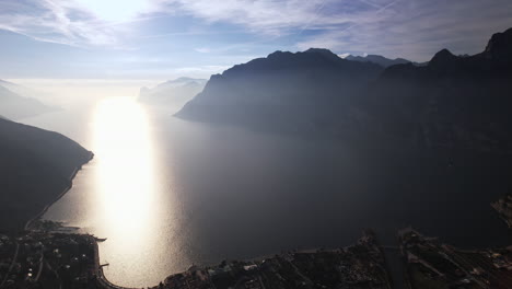 majestic aerial view of italys garda lake engulfed by scenic mountains