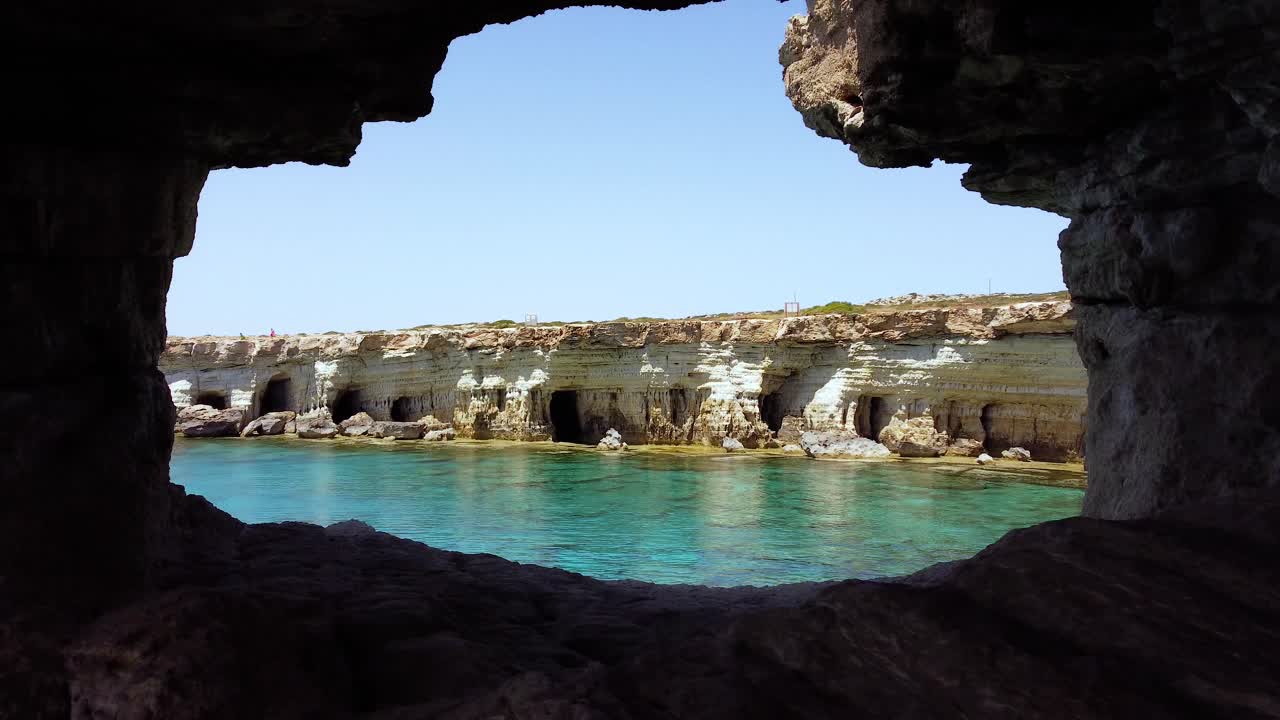 Cape Cavo Greco in the island of Cyprus. Aerial through a hole
