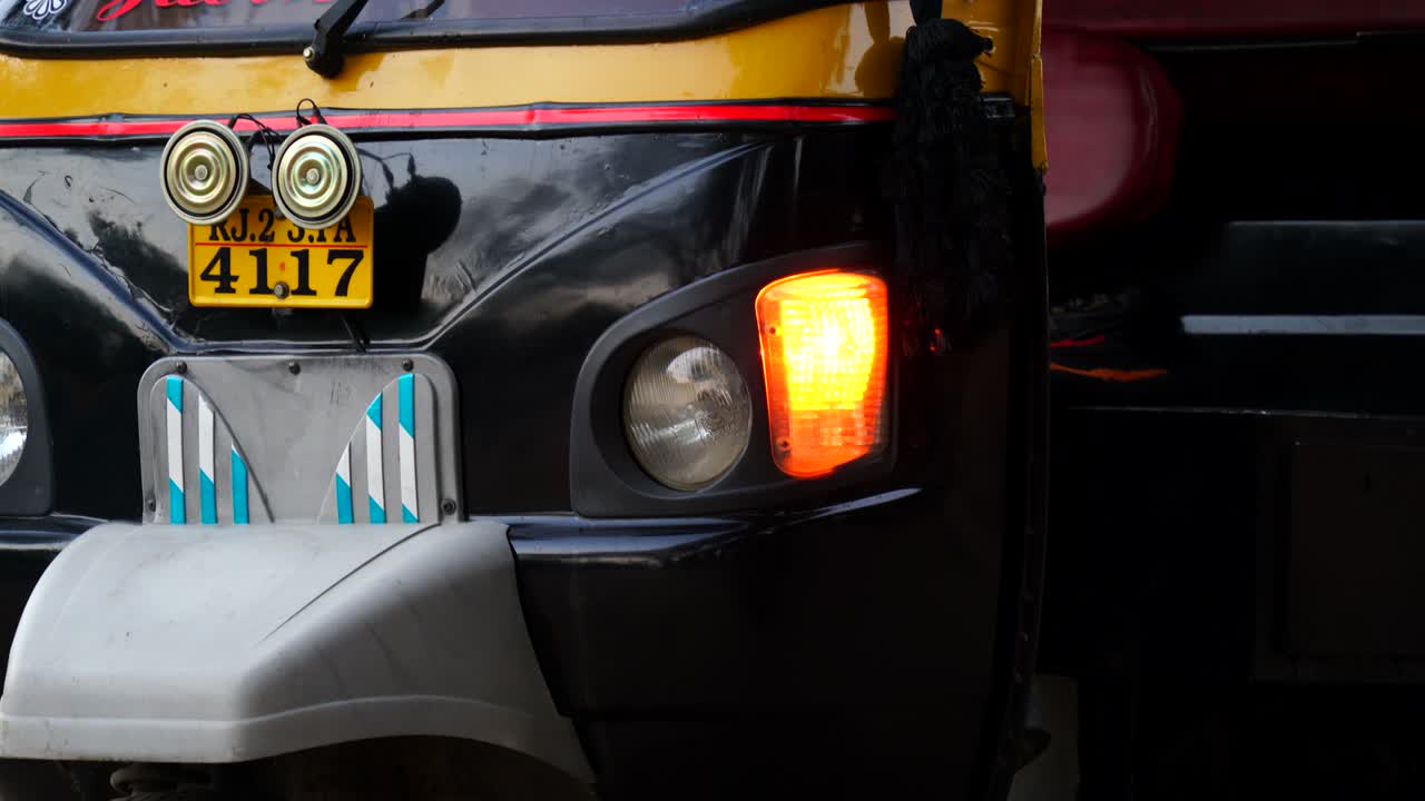 Auto Rickshaw side Light Indicator fluctuation with yellow color. 4k footage of automobile indicator light sign.