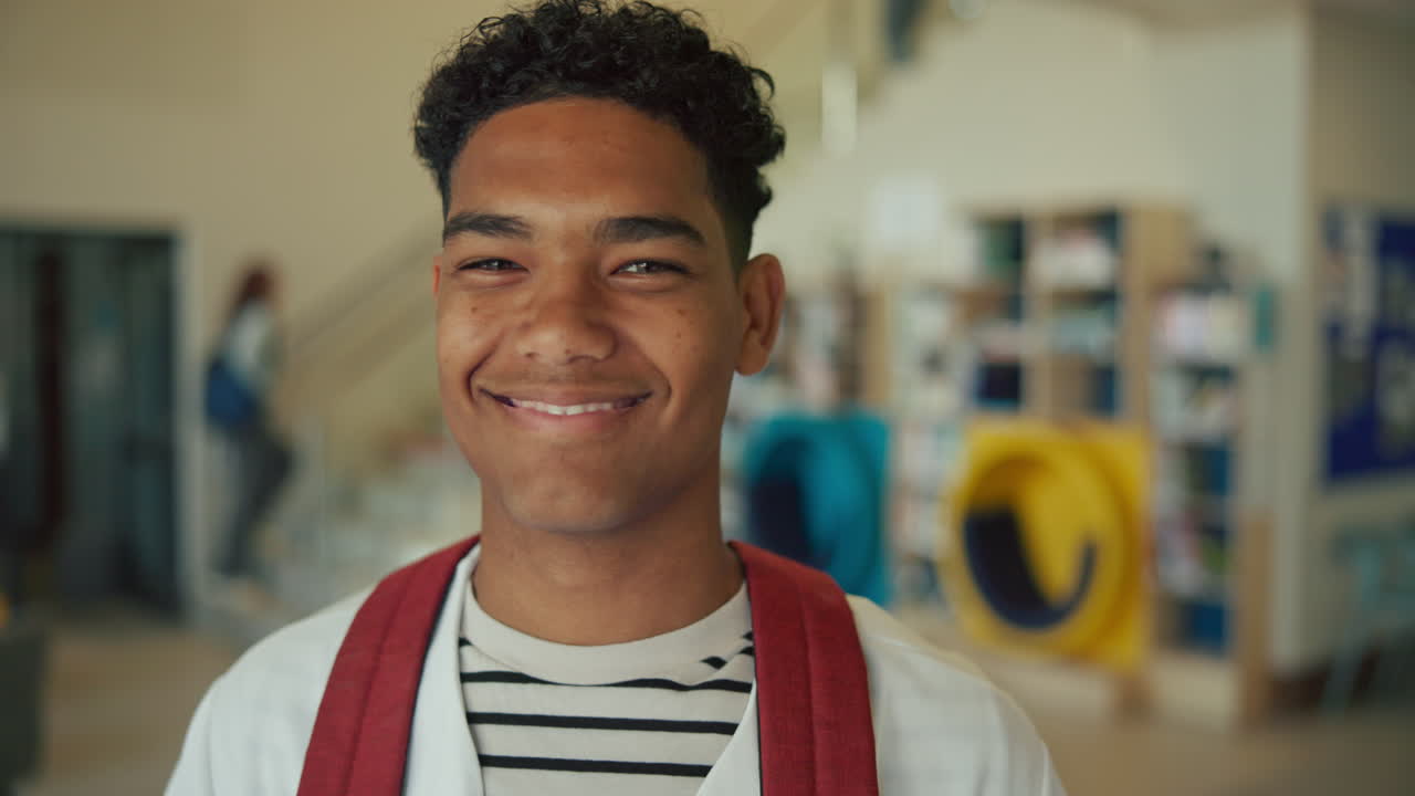 Portrait of smiling teenager at school