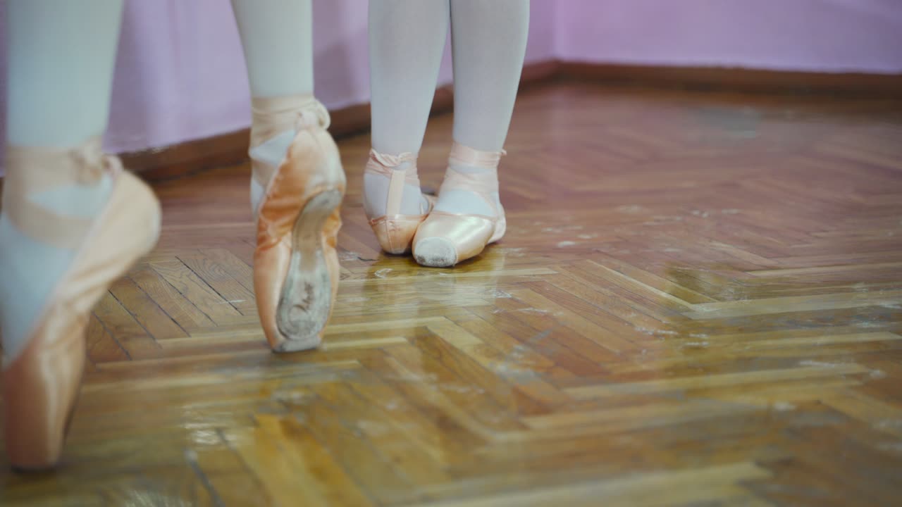 Ballet. Close-up of ballerina feet in pointe shoes. Woman's feet in pointe shoes.