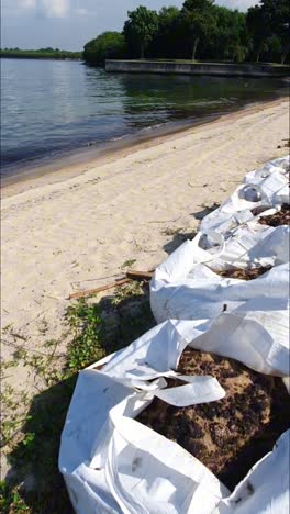 portrait-footage-of-Lazarus-Island-,-one-of-Singapore's-southern-islands-cleaned-up-beach-after-an-oil-spill-on-14th-june-2024