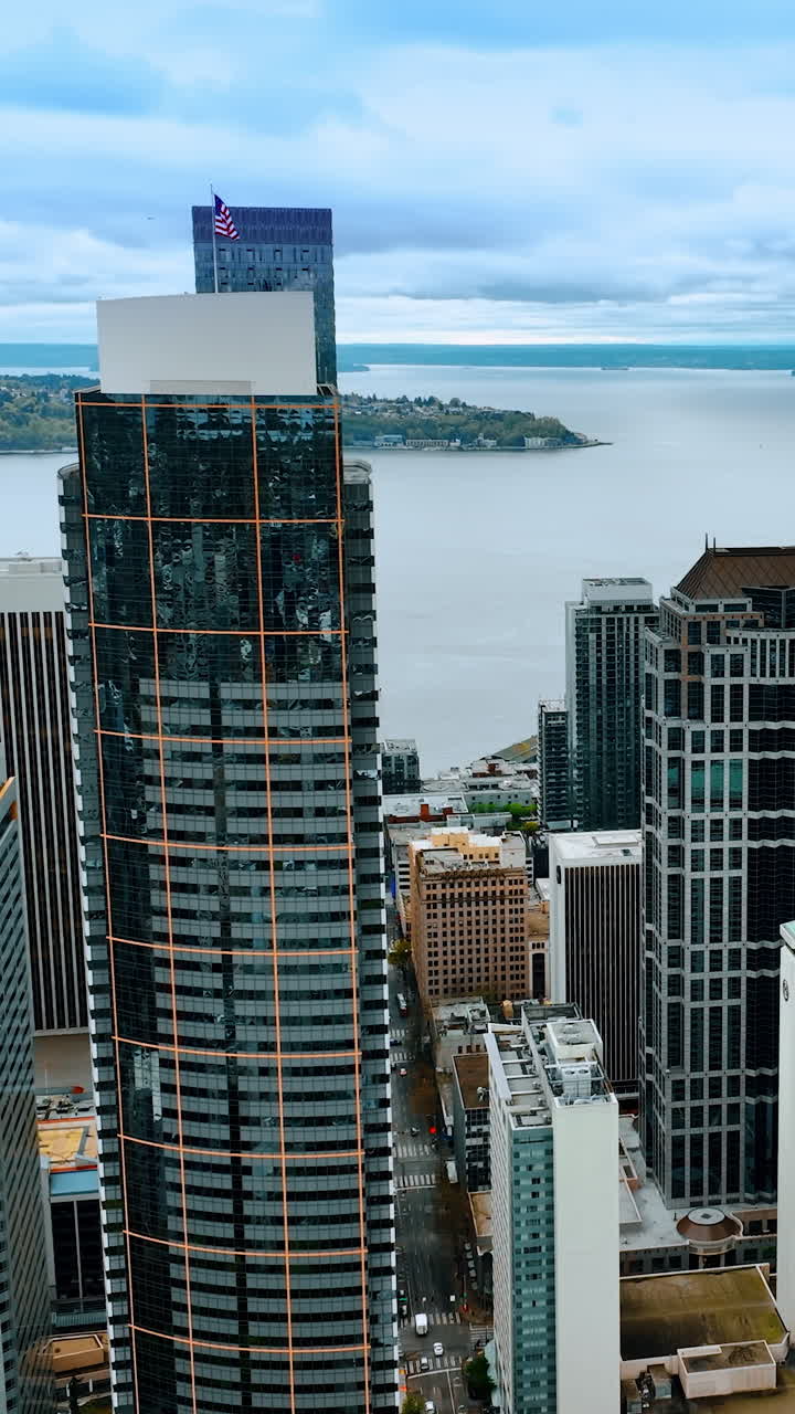 American business district flight over. Aerial view skyscrapers Seattle city. Vertical video