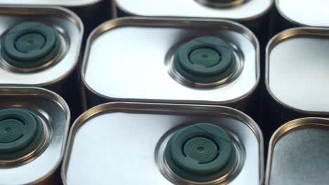 close-up of stacked olive oil cans