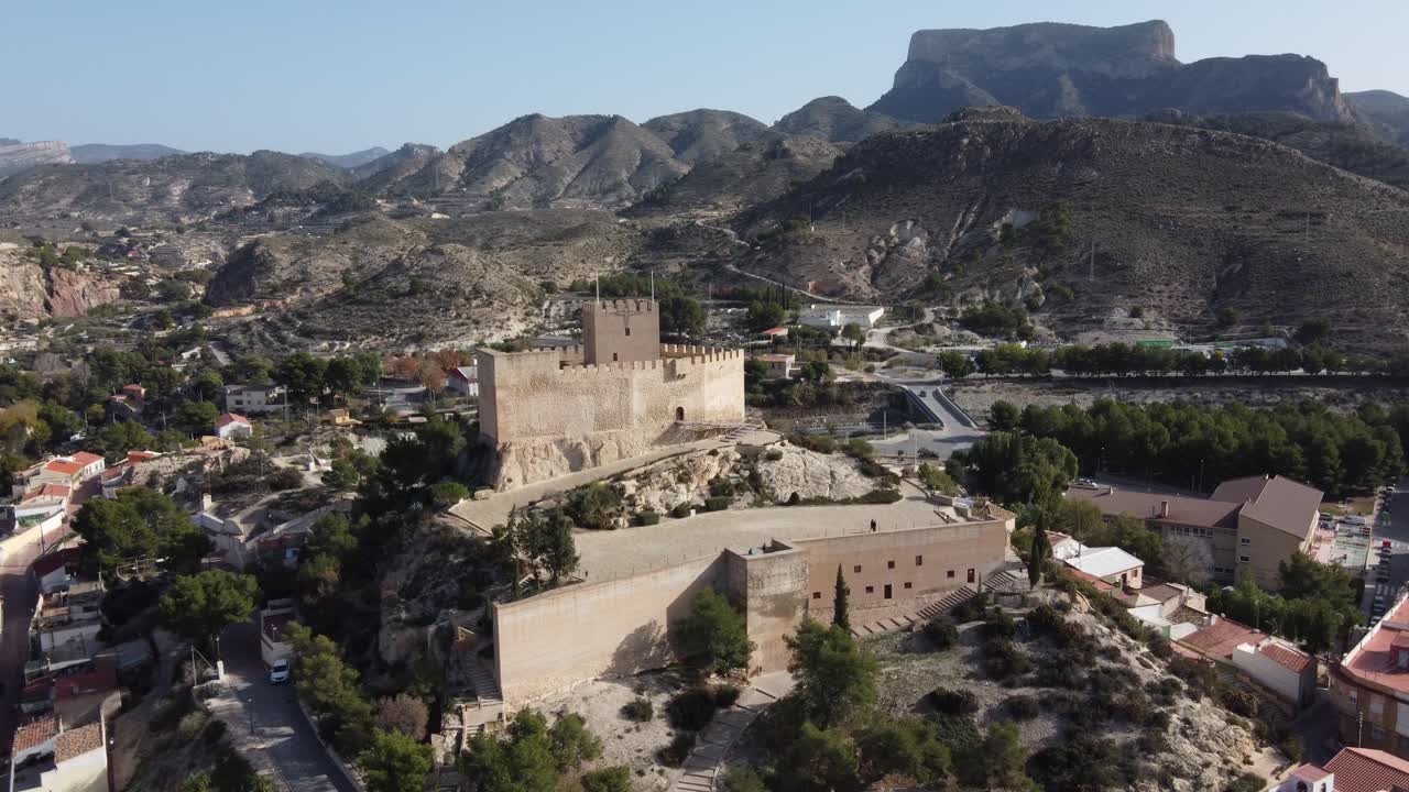 Static aerial view of the Petrer arab castle and Maigmo mountain range, Spain