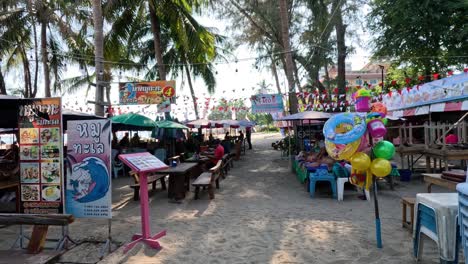 a busy market scene at a tropical beach setting