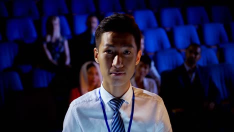 young asian businessman attending business seminar in auditorium 4k