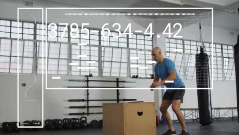 animation of digital data processing over biracial man exercising in gym, jumping on box