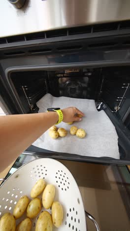 preparing small potatoes for baking in oven