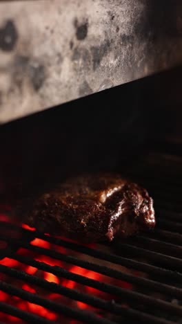 grilled steak on charcoal grill