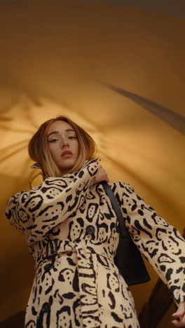 stylish woman in leopard print coat