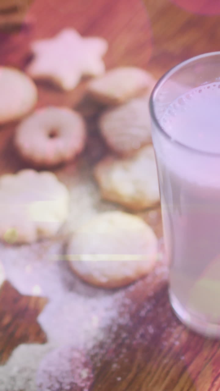 animación de puntos de luz sobre leche y galletas en navidad
