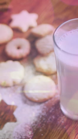 animation of light spots over milk and cookies at christmas