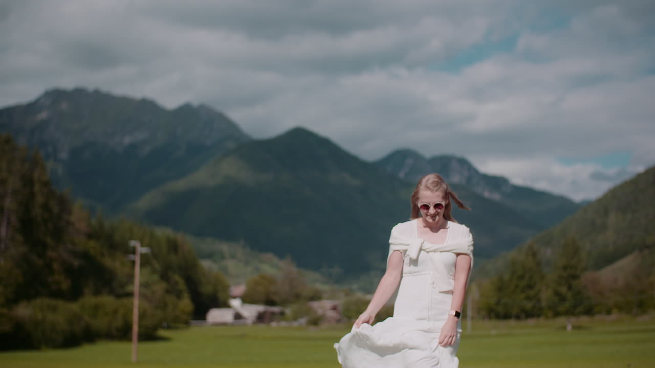 Woman Walking in Alpine Landscape