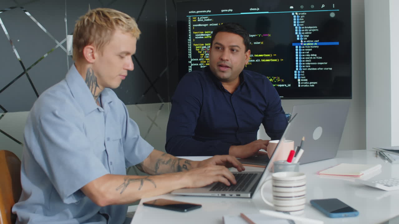 Male Coders Working at Office