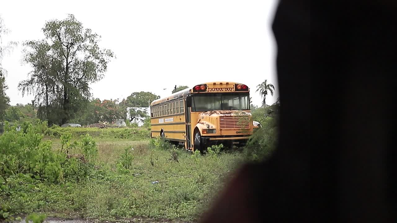 Dominican republic 25 June 2022 - Yellow bus abandoned in the forest. Zone Abandoned, rusty bus damaged