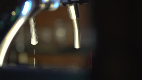 tapping a czech drought beer then putting it aside and leaving the tap in the shot