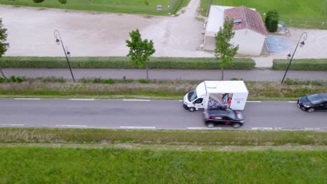 van driving on the highway transporting goods.