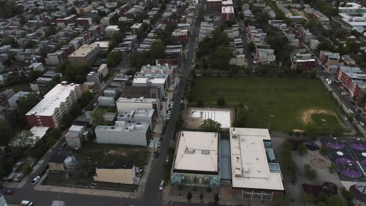 North Philadelphia drone during dusk looking down on street in the ghetto