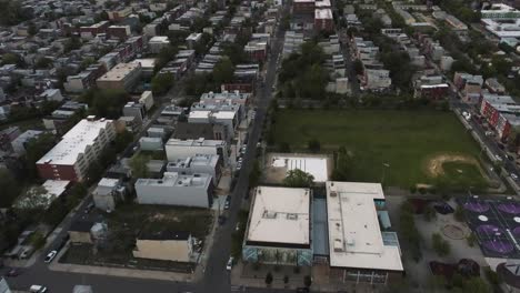 north philadelphia drone during dusk looking down on street in the ghetto