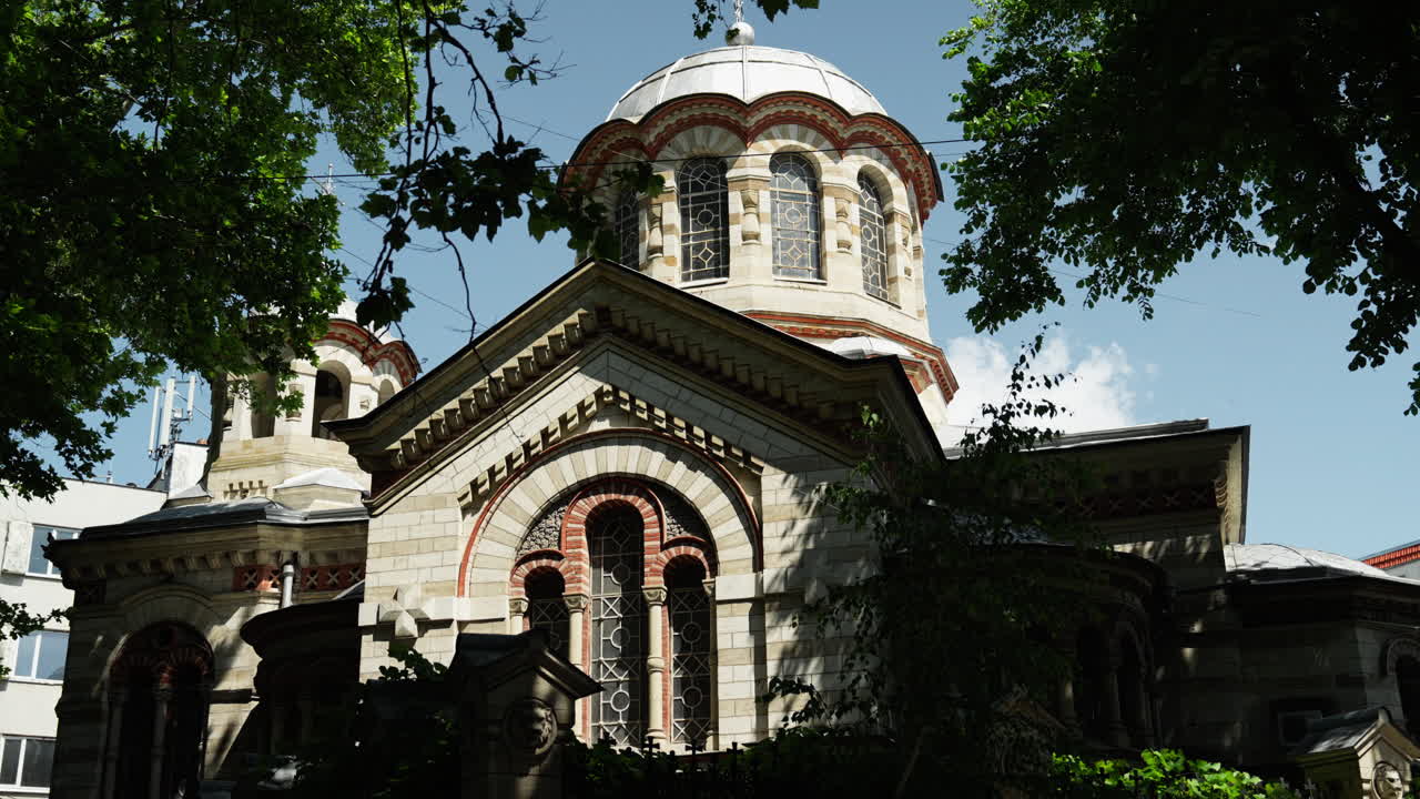 Beautiful Eastern Orthodox church in Chișinău, Moldova, featuring classic domes, detailed facades, and rich architectural heritage. Captured on a clear, sunny day.