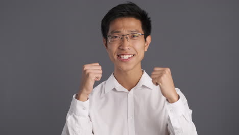 Asian-man-showing-yes-gesture-to-the-camera.