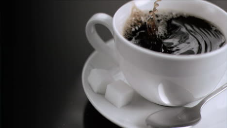 splash in super slow motion due to a sugar