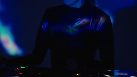 female dj performing in a nightclub