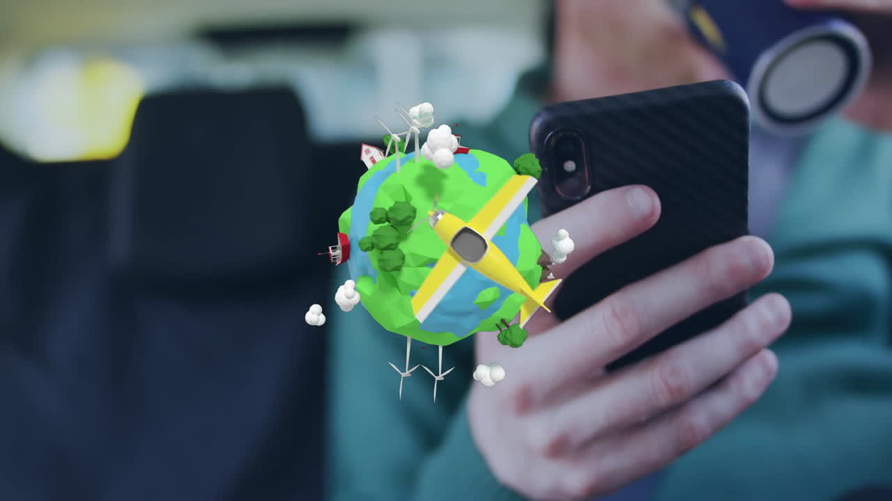 Animation of colorful globe with wind turbines and airplane above smartphone user