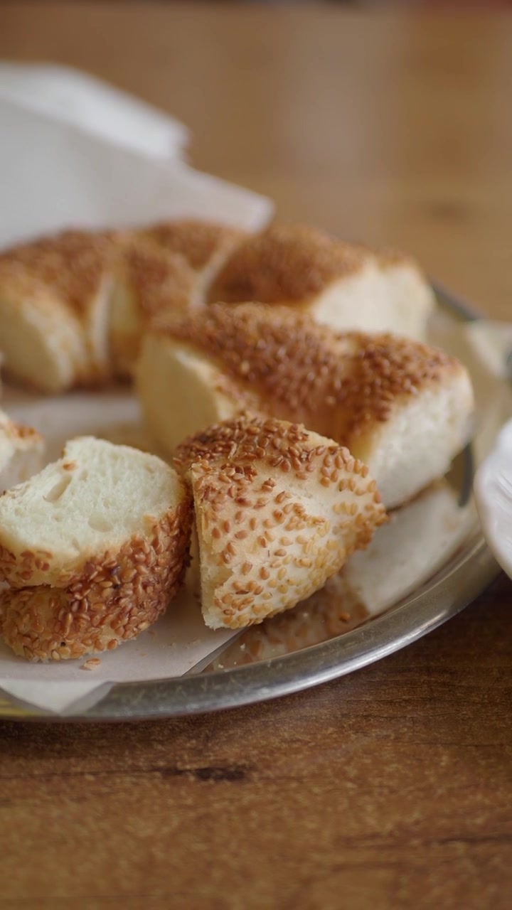 Freshly Sliced Turkish Simit with Sesame Seeds and Tea