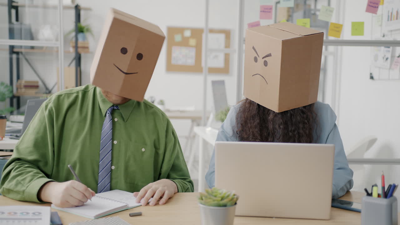 Employees with Cardboard Boxes on Their Heads