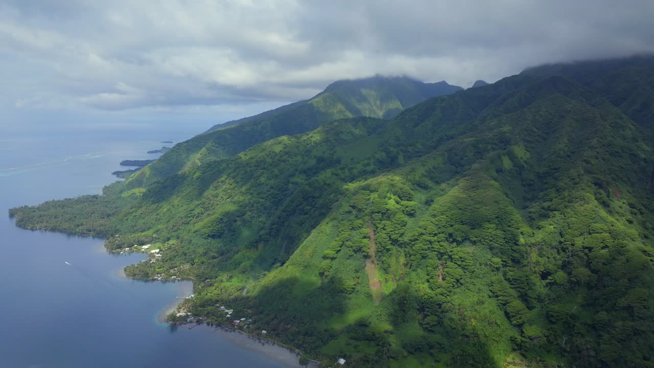 Aerial View of Lush Green Mountains and Coastline