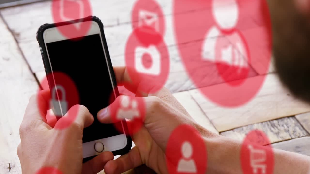 animación de múltiples iconos digitales sobre la vista trasera de un hombre que usa un teléfono inteligente