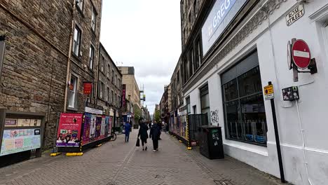 people walking down a busy festival street