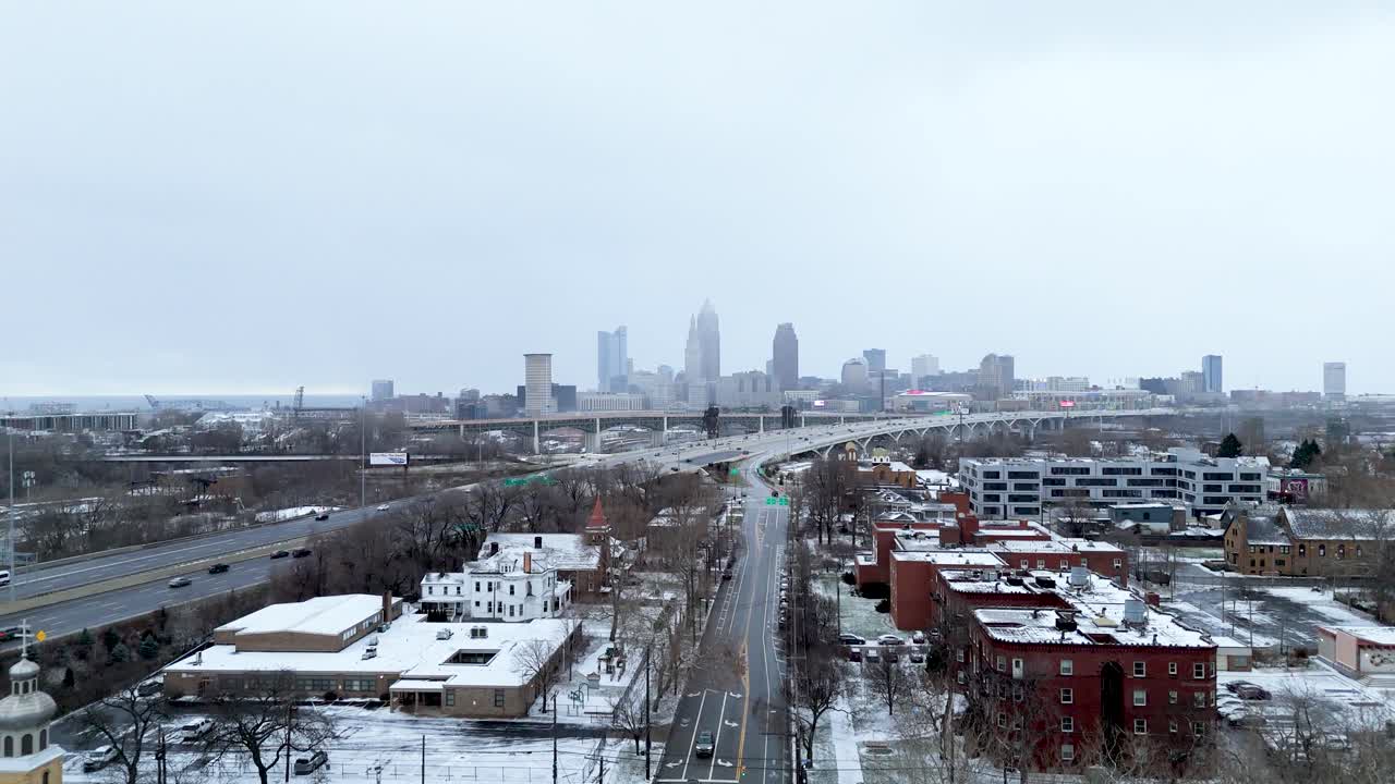 Aerial shot pushing in on a Downtown Cleveland, Ohio winter skyline.