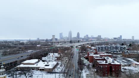aerial shot pushing in on a downtown cleveland, ohio winter skyline.