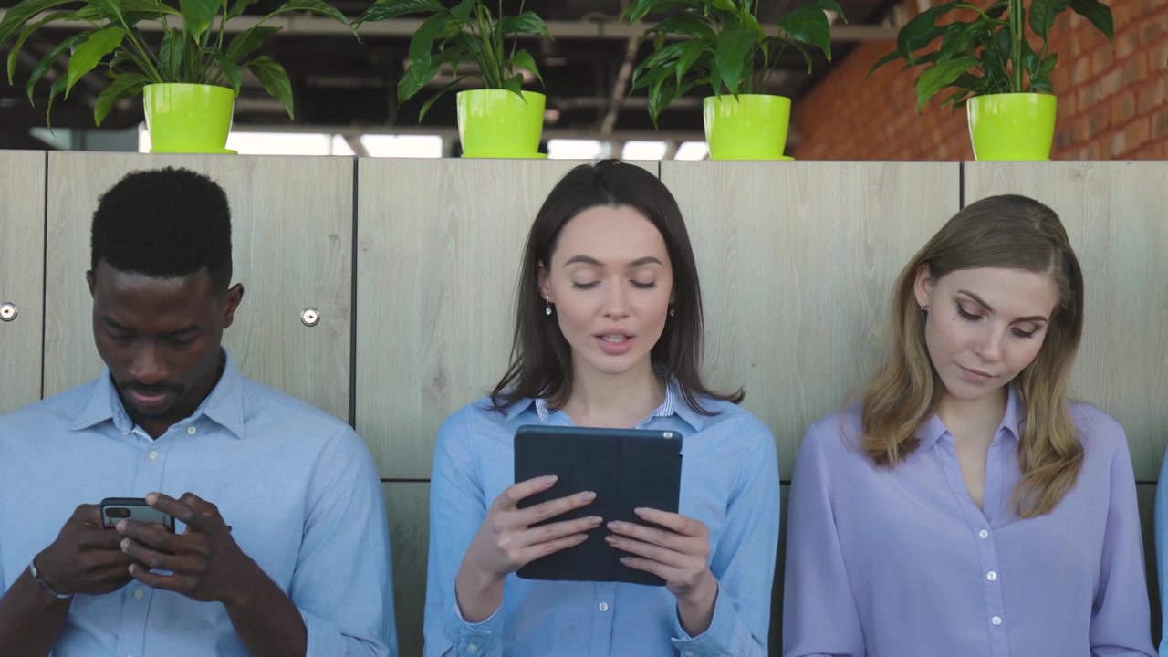 Diverse Group of Job Candidates Waiting in Office Lobby
