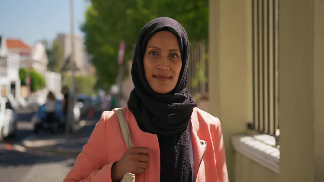 Young woman wearing hijab out and about in the city