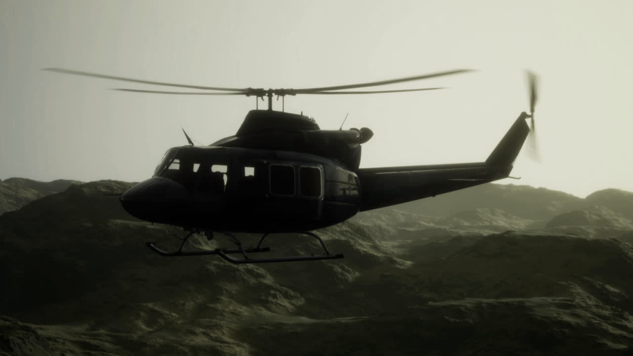 Helicopter flying over rugged mountains during twilight hours