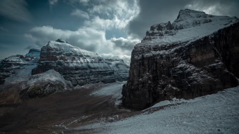 Time-Lapse-of-Dramatic-Clouds-Moving-Above-lacier-and-Snow-Capped-Cliffs,-Plain-of-Six-Glaciers-Hiking-Trail-Banff-National-Park,-Canada