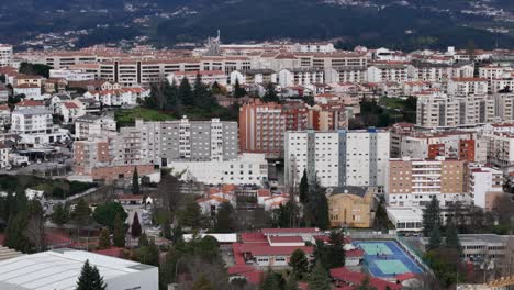 buildings in the city of vila real with mountains in the background