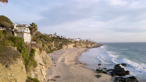 Scenic-aerial-view-of-California-coast-with-beautiful-beach-and-cliffs