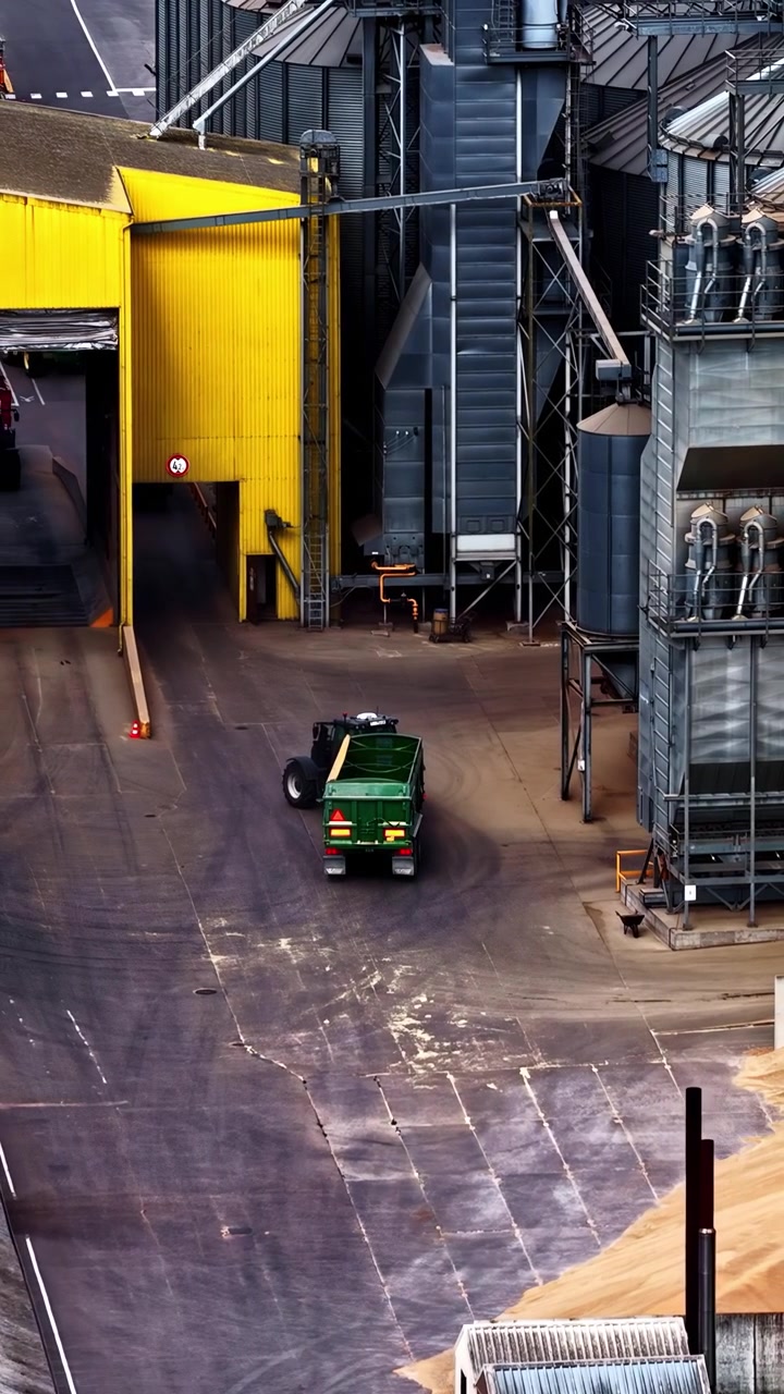 Vertical social ratio aerial video of an industrial grain factory in Riga, Latvia. Produced in 1080x1920 and with Rec709 color.