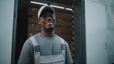 happy african american warehouse worker at a loading dock