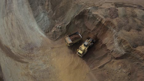 An-excavator-is-filling-up-a-huge-truck-at-a-nickel-mining-site-in-western-australia