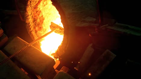 molten metal being poured in mold at foundry workshop 4k