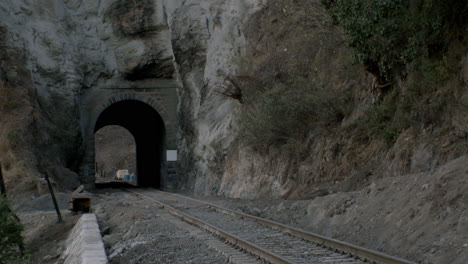 railroad tracks and tunnel alongside the country