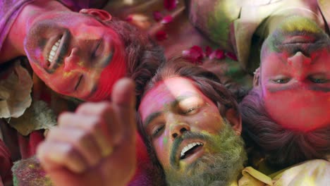 multi ethnic people celebrating the festival of colors holi in india