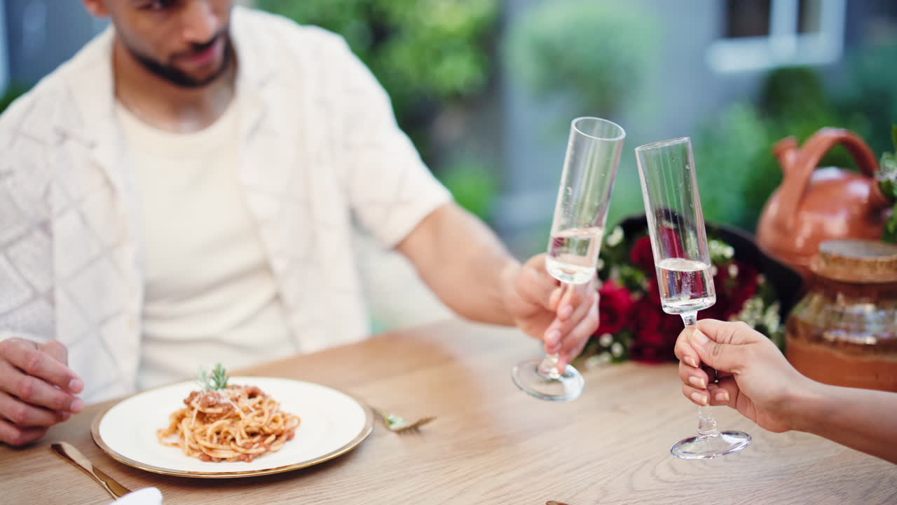 Couple Toasting with Champagne During a Romantic Outdoor Dinner