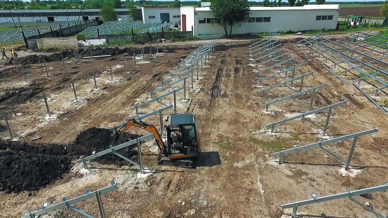 Industry machinery for construction. Aerial view of arm excavator working on field